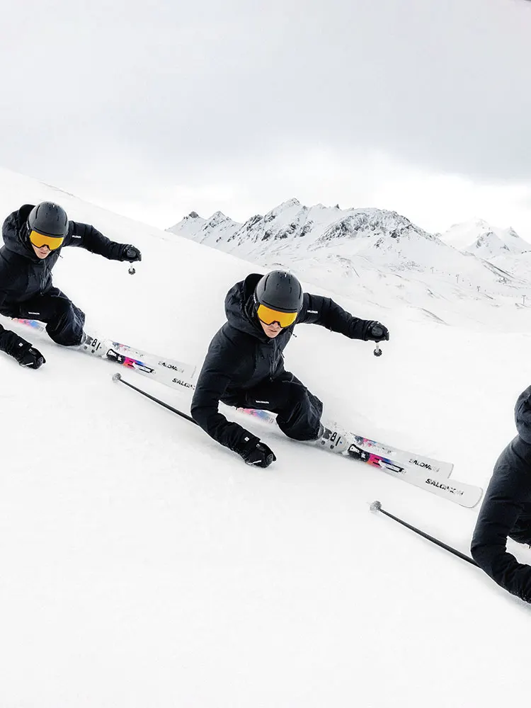 Skiers carving on snow (official Salomon photo)